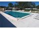 Inviting community pool with chairs, offering a perfect spot for relaxation and recreation in a serene neighborhood setting at 720 Fonda Ct # 54, Lakeland, FL 33803