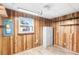 Storage room with wood paneling, vinyl flooring and one window at 735 Formosa Ave, Bartow, FL 33830