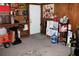 Basement featuring wood paneled walls, carpeted floors, and ample storage space at 807 S 1St St, Lake Wales, FL 33853