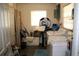 Functional laundry room with washer, dryer, and storage space with a window for natural light at 807 S 1St St, Lake Wales, FL 33853