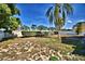 Expansive backyard with a white fence providing privacy and lush landscaping at 851 Hunt Cir, Lake Wales, FL 33853