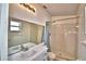 Bathroom with white tile shower, single sink vanity, and a large mirror at 851 Hunt Cir, Lake Wales, FL 33853