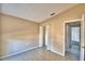 Neutral bedroom featuring tile floors and a closet space with bi-fold doors at 851 Hunt Cir, Lake Wales, FL 33853