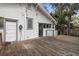Spacious wood back deck featuring a door to the house, as well as the backyard at 907 Vistabula St, Lakeland, FL 33801
