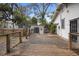 Spacious wood back deck leads to a fenced backyard featuring a storage shed at 907 Vistabula St, Lakeland, FL 33801