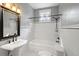 Classic bathroom with white subway tile, black accents, and a pedestal sink at 907 Vistabula St, Lakeland, FL 33801