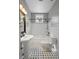Charming bathroom with tiled floor, classic fixtures, and ample natural light at 907 Vistabula St, Lakeland, FL 33801
