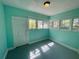Cozy room with light-blue walls and painted floors at 907 Vistabula St, Lakeland, FL 33801