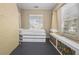 Bedroom with built-in storage, natural light, and stylish panels along the wall at 907 Vistabula St, Lakeland, FL 33801