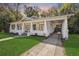 Charming home with a covered front porch and driveway leading to a covered carport at 907 Vistabula St, Lakeland, FL 33801