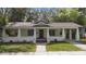 Charming single story home with a covered front porch and landscaped front yard at 907 Vistabula St, Lakeland, FL 33801