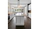 Bright eat-in kitchen with an island and dark hardwood floors at 907 Vistabula St, Lakeland, FL 33801