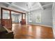 Large living room with hardwood floors, wood trim, fireplace and detailed ceilings at 907 Vistabula St, Lakeland, FL 33801