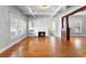 Living room featuring a decorative fireplace, crown moulding, and hardwood floors at 907 Vistabula St, Lakeland, FL 33801
