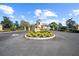 Lake Ashton community entrance featuring manicured landscaping and an elegant entryway at 1017 Sawgrass Dr, Winter Haven, FL 33884