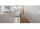 Hallway with gray walls and brown carpeted floor, leading to bedrooms and bathrooms at 1018 Roberta Rd, Lake Wales, FL 33853