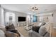 Bright and airy living room with neutral tones, ceiling fan, and a large window at 1018 Roberta Rd, Lake Wales, FL 33853