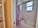 Well-lit bathroom with a combination tub and shower and vibrant decor at 105 Wyndham Dr, Winter Haven, FL 33884