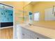 Bathroom with a modern vanity, large mirror, open shelving, and views into the bedroom at 105 Wyndham Dr, Winter Haven, FL 33884