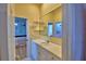 Well-lit bathroom with a vanity and access to the bedroom and shower area at 105 Wyndham Dr, Winter Haven, FL 33884