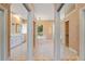Bright bathroom featuring a soaking tub, tiled floor, double vanity, and large mirrors at 105 Wyndham Dr, Winter Haven, FL 33884