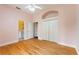 Bright bedroom with wood floors and an en-suite bathroom featuring modern fixtures and decor at 105 Wyndham Dr, Winter Haven, FL 33884