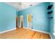 bedroom featuring fun alphabet wall decor, wooden floors, and an en-suite bathroom at 105 Wyndham Dr, Winter Haven, FL 33884