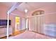 Bright bedroom with a four-poster bed, storage, and view of the adjacent bathroom at 105 Wyndham Dr, Winter Haven, FL 33884