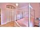 Elegant bedroom with a four-poster bed, closet, and hardwood floors at 105 Wyndham Dr, Winter Haven, FL 33884