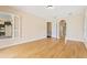Bedroom with wood floors, shutters, and access to an en-suite bathroom at 105 Wyndham Dr, Winter Haven, FL 33884