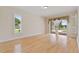 Spacious bedroom boasts wood floors, ample natural light, and access to outdoor living at 105 Wyndham Dr, Winter Haven, FL 33884