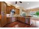 Spacious kitchen boasting stainless steel appliances, granite counters, and hardwood floors, creating a warm and inviting atmosphere at 105 Wyndham Dr, Winter Haven, FL 33884