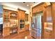 Stylish kitchen featuring stainless steel appliances, custom cabinetry, and hardwood floors at 105 Wyndham Dr, Winter Haven, FL 33884