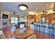 Spacious living room with breakfast bar, fireplace, and open floor plan at 105 Wyndham Dr, Winter Haven, FL 33884