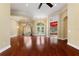 Large living area with hardwood floors, archways, and ample natural light at 105 Wyndham Dr, Winter Haven, FL 33884