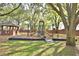 Community playground with swing set, slide, and monkey bars, perfect for Gathering fun at 105 Wyndham Dr, Winter Haven, FL 33884
