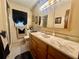 Bathroom featuring a vanity with a marble countertop, and a shower with a window at 1050 E Eagle Ave, Eagle Lake, FL 33839