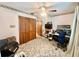 Bedroom with an office featuring a ceiling fan, carpet floors, and natural light at 1050 E Eagle Ave, Eagle Lake, FL 33839