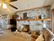 Cozy living room featuring a brick fireplace with wood mantel and decorative elements at 1050 E Eagle Ave, Eagle Lake, FL 33839