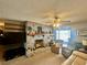 Cozy living room featuring a brick fireplace and comfortable seating at 1050 E Eagle Ave, Eagle Lake, FL 33839