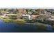Waterfront home featuring a screened porch overlooking the lake, plus a spacious yard at 1050 E Eagle Ave, Eagle Lake, FL 33839