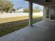 View of a backyard from a covered patio at 1205 Lake Loop Rd, Winter Haven, FL 33880