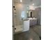 Contemporary bathroom with a walk-in shower with glass enclosure, and a stylish vanity with modern fixtures at 1205 Lake Loop Rd, Winter Haven, FL 33880
