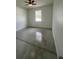 Bright bedroom with a ceiling fan and a view from the window at 1205 Lake Loop Rd, Winter Haven, FL 33880