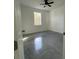 Well-lit bedroom featuring a ceiling fan and a window at 1205 Lake Loop Rd, Winter Haven, FL 33880