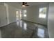 Bright bedroom with lots of natural light from three windows and glass patio doors to the backyard at 1205 Lake Loop Rd, Winter Haven, FL 33880