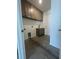 Laundry room featuring upper cabinets, a sink, and washer/dryer hookups at 1205 Lake Loop Rd, Winter Haven, FL 33880