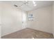Modest carpeted bedroom with neutral walls and ceiling, with a single window at 1229 Rawls Dr, Lakeland, FL 33801