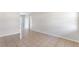 Neutral room featuring tile floors, light colored walls, and views down adjacent hallways at 1229 Rawls Dr, Lakeland, FL 33801