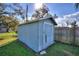 Exterior view of shed in a well maintained backyard with mature trees at 1229 Rawls Dr, Lakeland, FL 33801